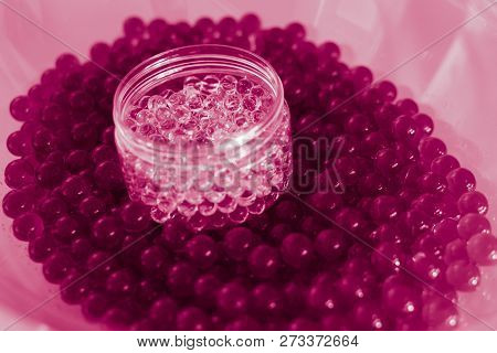 Water Pink Gel Balls With Bokeh. Polymer Gel. Silica Gel. Balls Of Pink Hydrogel. Crystal Liquid Bal