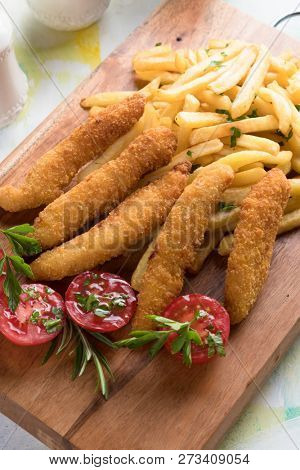 Deep fried chicken frites with potato chips or french fries