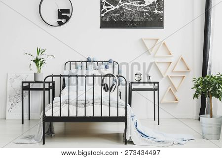 Black Map And Clock On White Wall Of Stylish Kid's Bedroom With Industrial Single Bed And Nightstand