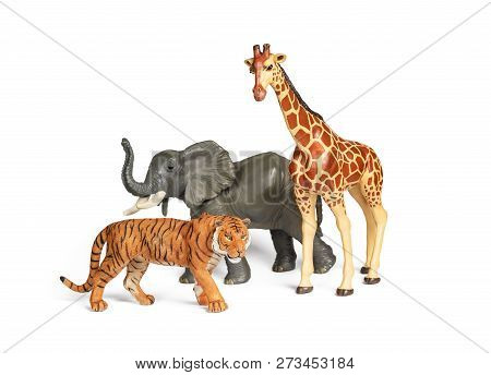 Pastic Wild African Animal Toys Isolated On White. Tiger, Elephant And Giraffe. Children Animal Char