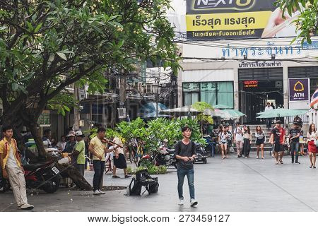 Bangkok, Thailand - February 28, 2018: Thai Young Musician Playing The Violin At The Entrance To The