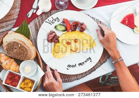 Top Up View Of Woman Hands Having Breakfast With Omlete In Restaurant. Bali Island.