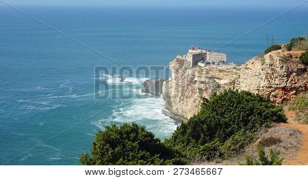 Famous Surf Spot At Nazare Lighthouse In Portugal