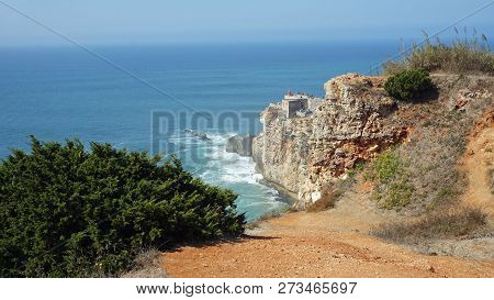 Famous Surf Spot At Nazare Lighthouse In Portugal