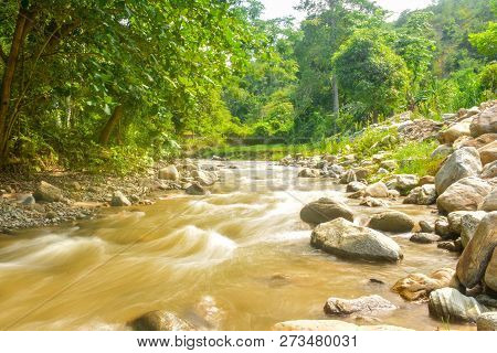 The Beautiful Paniki River With Its Gentle Flow And Brownish Yellow Water During The Rainy Season