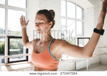 Taned Fit Girl Resting Between Workout Approaches Indoor Sunny Gym. Slim Woman Wearing Sportswear St