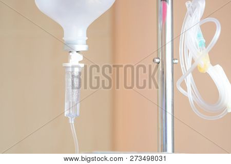 Close Up Saline Iv Drip For Patient And Infusion Pump In Hospital.