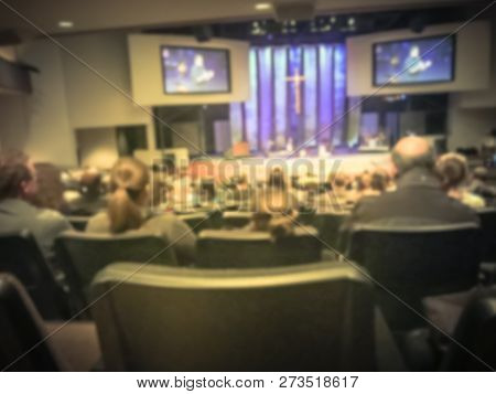 Filtered Image Blurry Background Rear View Audience At Bible Church With Preacher On Stage