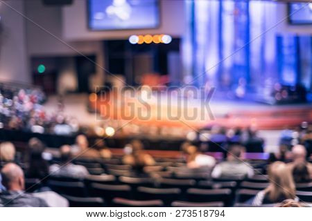 Filtered Image Blurry Background Rear View Audience At Bible Church With Preacher On Stage