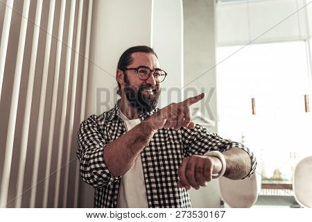 Delighted Joyful Man Pointing With Is Finger