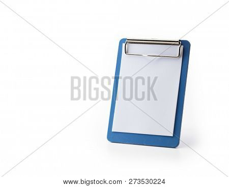 Blue vertical clipboard or paper stand, isolated on white. Focus is on the upper clipboard clip section.