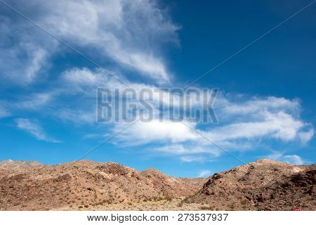 Sceinc Desert Landscape Against Blue Sky Along Highway 93 At United States