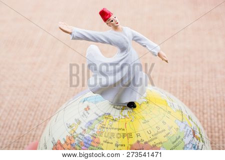 Swirling Dervish On A Globe On A Textured Background