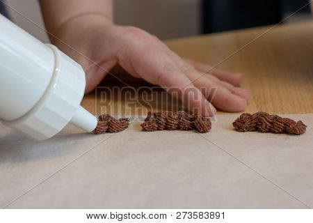 Baking Christmas Cookies With A Woman Hand