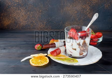 Chocolate Cookies, Cream And Strawberry Dessert In A Glass On A Darkbackground , Delicious Trifle, C