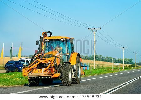 Agricultural Tractor In The Highway Road In Poland.