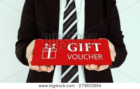 Gift Voucher Concept. Businessmen Send Red Gift Voucher Card.