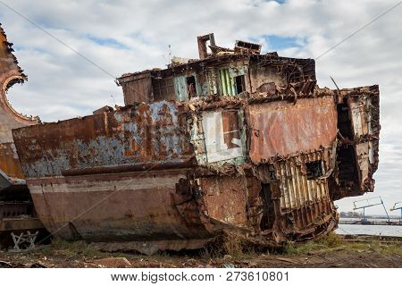 Huge Rusty Pieces Of Decommissioned Marine Ship That Was Cut And Left On The Shore.