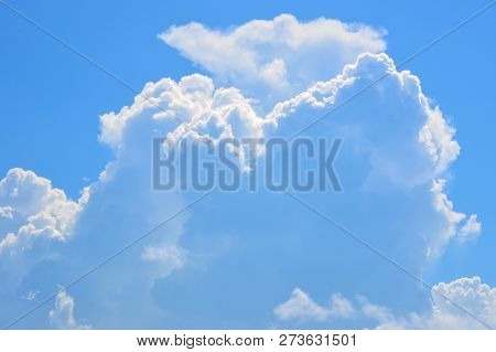 Blue Sky With Clouds Above The Sea