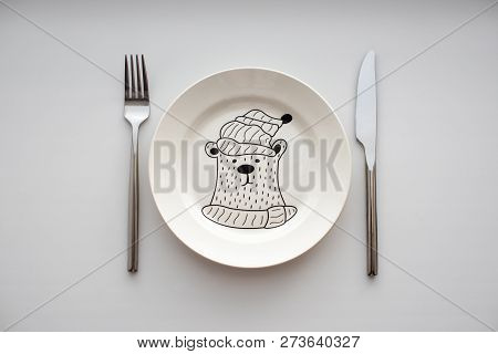 Empty Plate With Bear, Fork And Knife