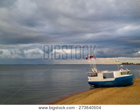 Fishing Boat On Baltic Sea Coast. Stormy Weather. Mechelinki, Poland, Pucka Bay.