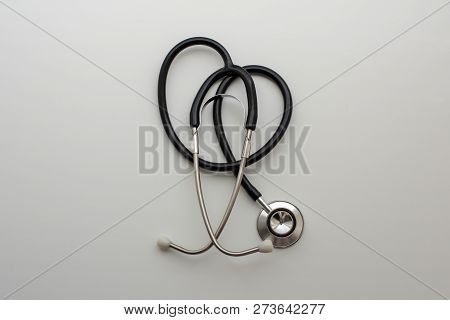 Medical Stethoscope In Shape Of Heart On The Table