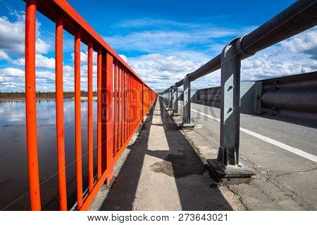 Multi-colored Bridge Over The River Going Nowhere