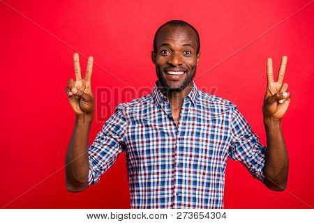 Portrait Of He Nice Handsome Cheerful Cheery Positive Guy Wearing Checkered Shirt Showing Double V-s