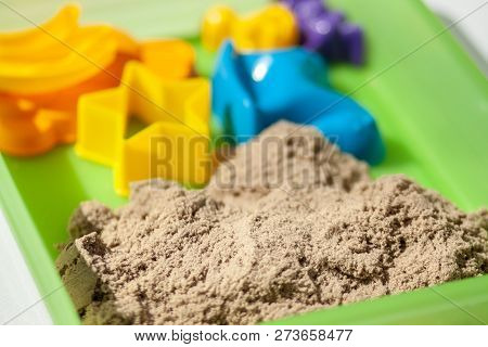 Kinetic Sand Close-up. Plastic Molds For The Game With Kinetic Sand.
