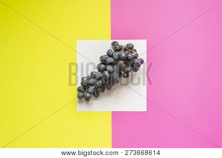 Top View Of Flat Lay Of Bunch Of Grapes On Double Color Sirface Background