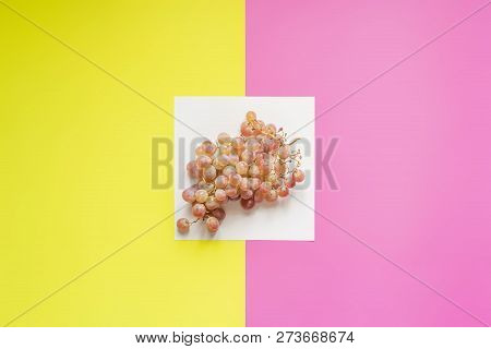 Top View Of Flat Lay Of Bunch Of Grapes On Double Color Sirface Background