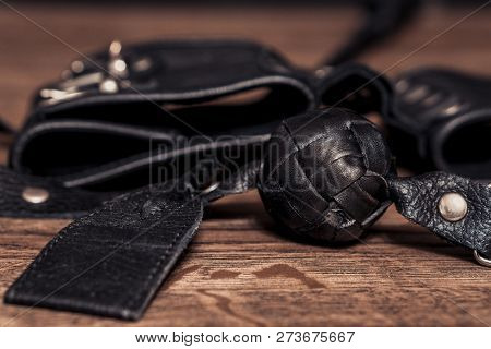 Sex Toys On Wood Background. Bdsm Or Fetish Concept