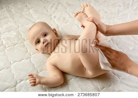 Mom Ass Wipes Baby Wet Wipes. Hygiene - Young Momy Wiping The Baby Skin With Wet Wipes. Cleaning Wip