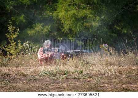 Sambek, Rostov Region, Russia, August 19, 2018: Reconstruction Of Afghan War. Mujahid Shoots A Machi