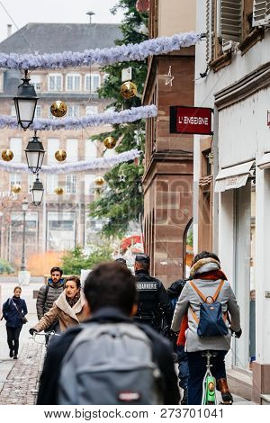 Strasbourg, France - Dec 11, 2018: Rear View Of French Police Officers Securing Rue De Loutre City C