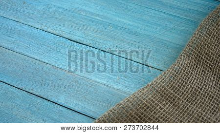 Blue Wooden Table Covered With Rastic Tablecloth