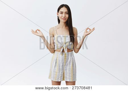 Let Us Calm Down And Bring Peace In Life. Attractive Relaxed Asian Female With Long Natural Dark Hai
