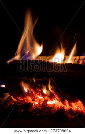 Flames From Carbonized Wood Giving Light To The Darkness