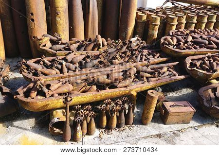 Assortment Of Rusted Munitions, Unexploded Ordnance, Bombs And Bombies Recovered From The Countrysid