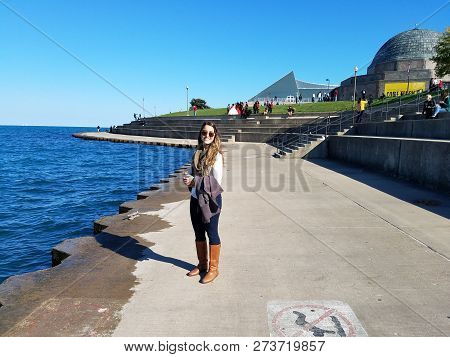 Chicago, Illinois 10-08-2016 Young Woman Enoys Skyline Walk On A Clear, Sunny Fall Day, With Adler P