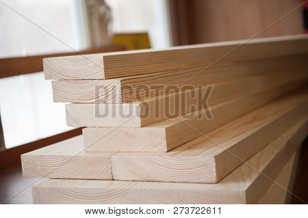 Wood Boards. Timber In Stock. Many New Boards In Stock. Planed Boards Are Stacked.
