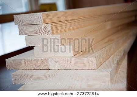 Wood Boards. Timber In Stock. Many New Boards In Stock. Planed Boards Are Stacked.