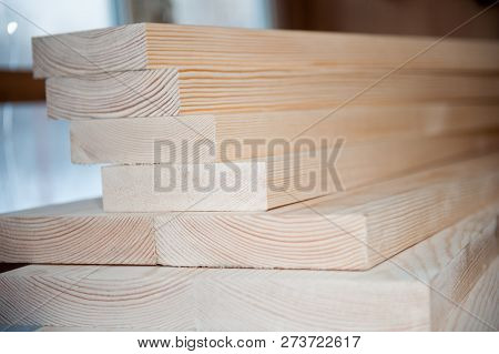 Wood Boards. Timber In Stock. Many New Boards In Stock. Planed Boards Are Stacked.