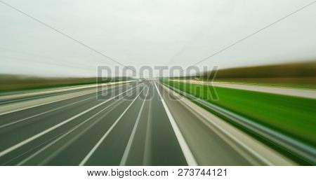 Long Exposure Blurred Photo Of High Pov Fast Driving On A Road In The City With Cars, Trucks