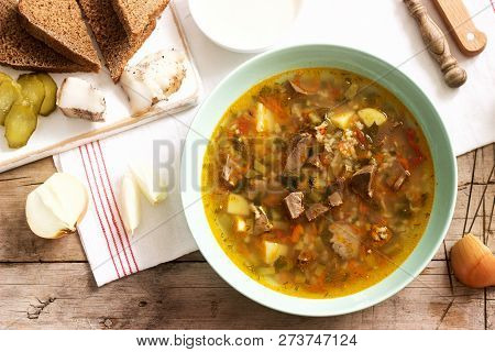 Rassolnik, Traditional Russian Soup, Served With Various Snacks And Vodka. Rustic Style.
