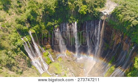 Beautiful Waterfall Coban Sewu In Tropical Forest, Java Indonesia. Aerial View Tumpak Sewu Waterfall