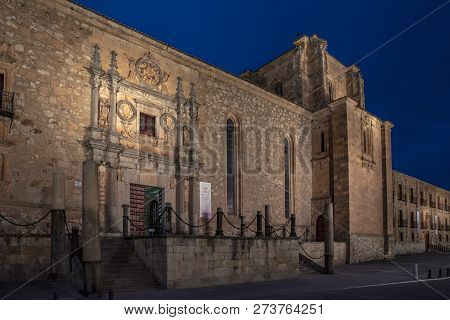 Night View Of The Facade Of The Colegio Arzobispo Fonseca In Salamanca