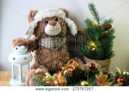 Christmas Background With A Teddy Bear, Christmas Tree And Decoration