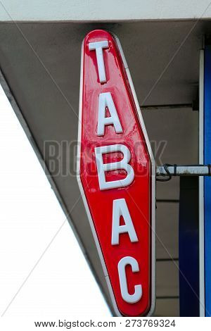 Modern White And Red Tabac Sign On Wall In Monaco, Europe. Close Up View