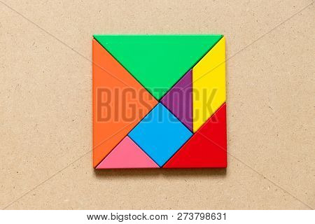 Color Tangram Puzzle In Square Or Rectangle Shape On Wood Background